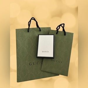 Gucci shopping bags and gift card box.